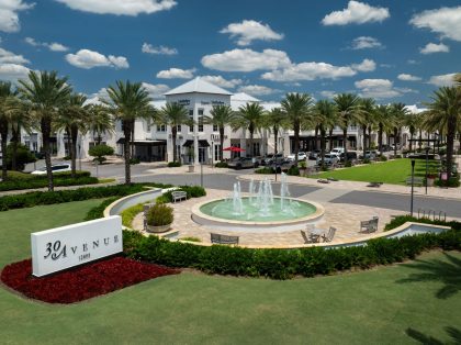 view of the 30 Avenue sign, palm trees, and mall